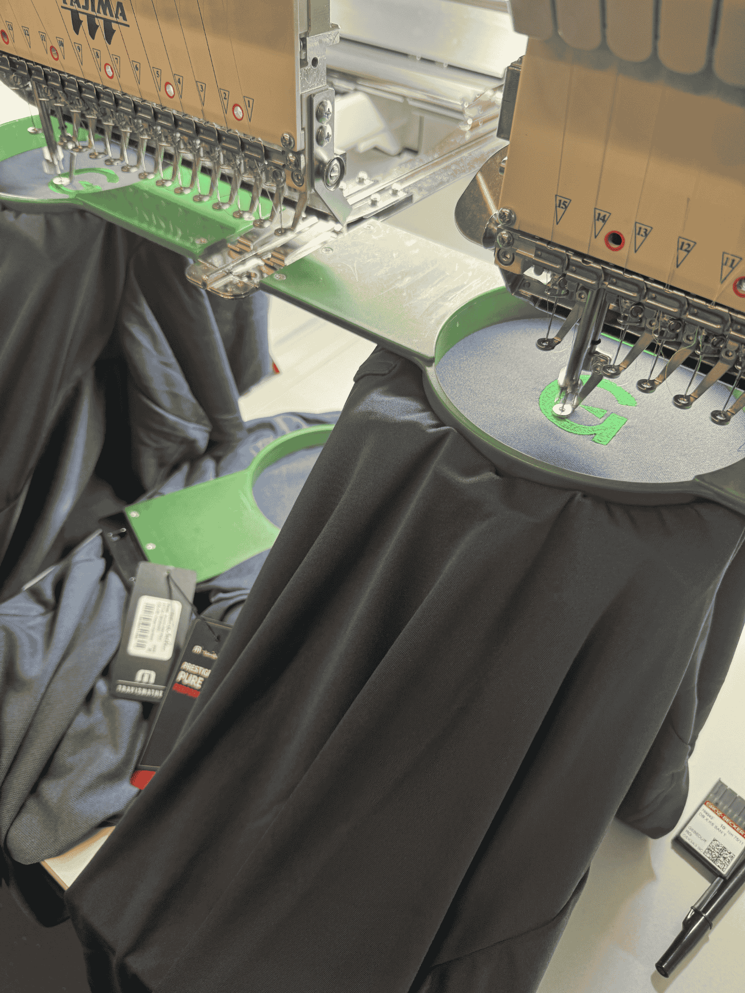 user-inserted A machine in operation, producing a shirt on a factory assembly line.